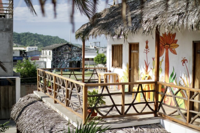 A small shared balcony in front of the private rooms