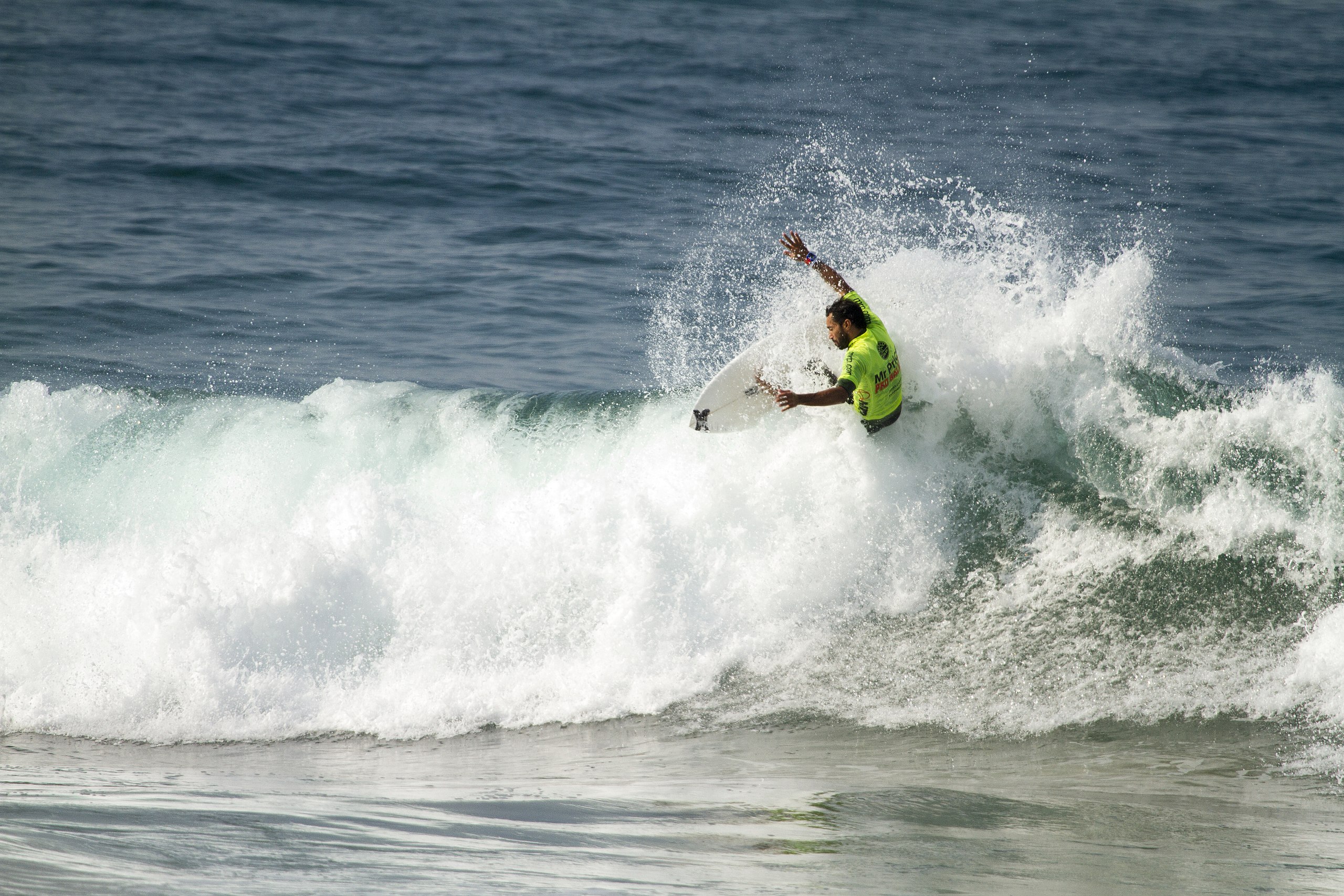 a surfer rips a wave